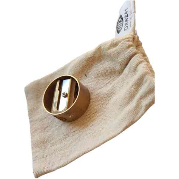 Block sharpener and ring built from massive brass single packed into muslin bag
